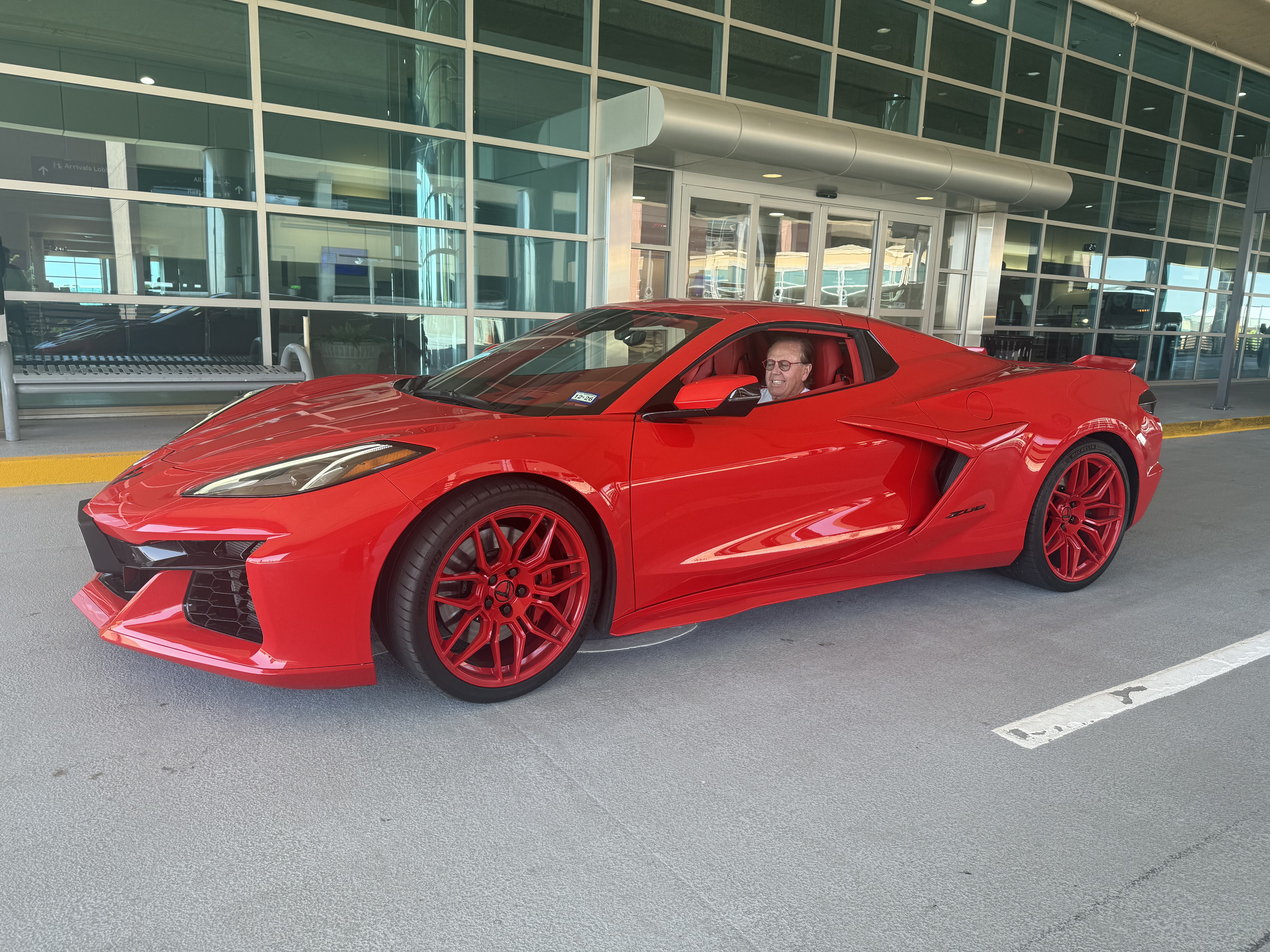 Billy Krause seated in his red 2024 Corvette Z06